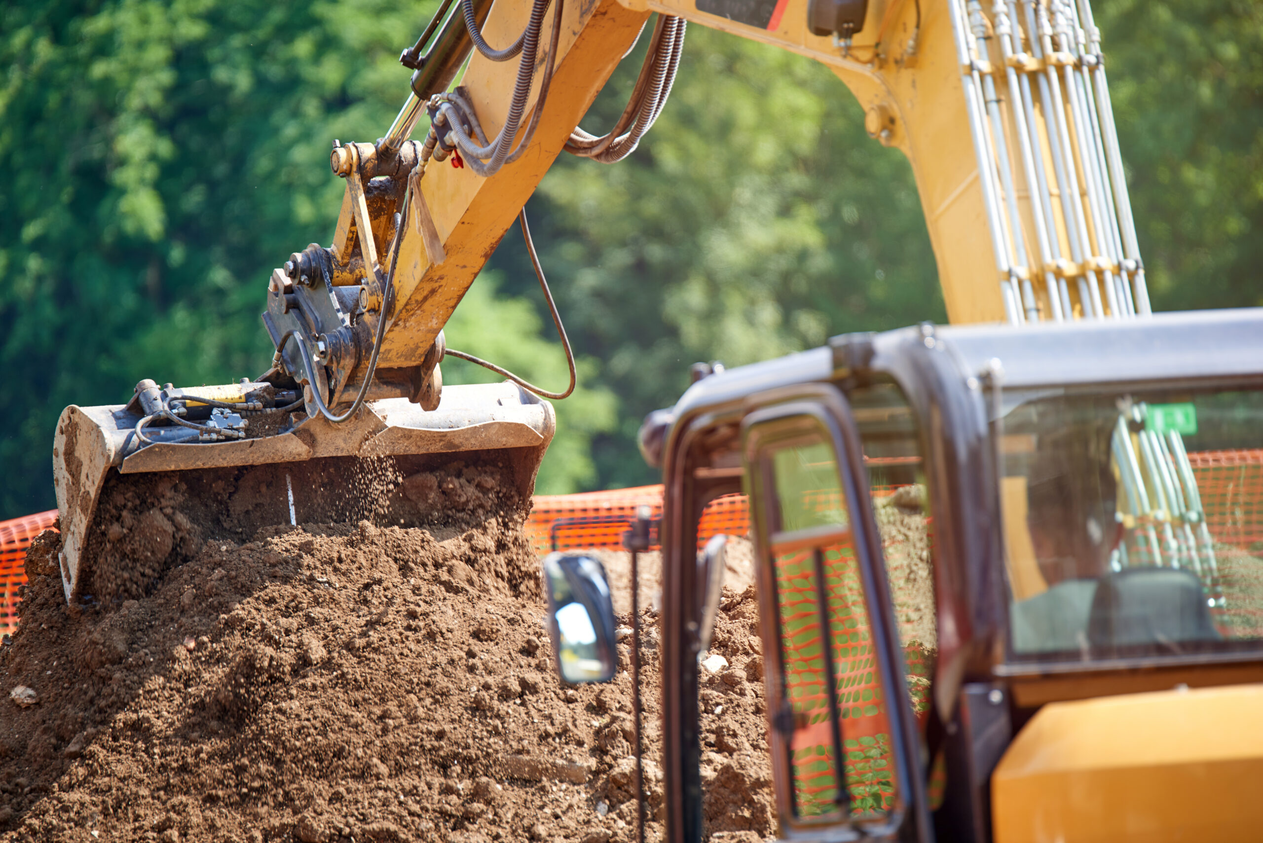 Backhoe - Bulldozer in open field operation